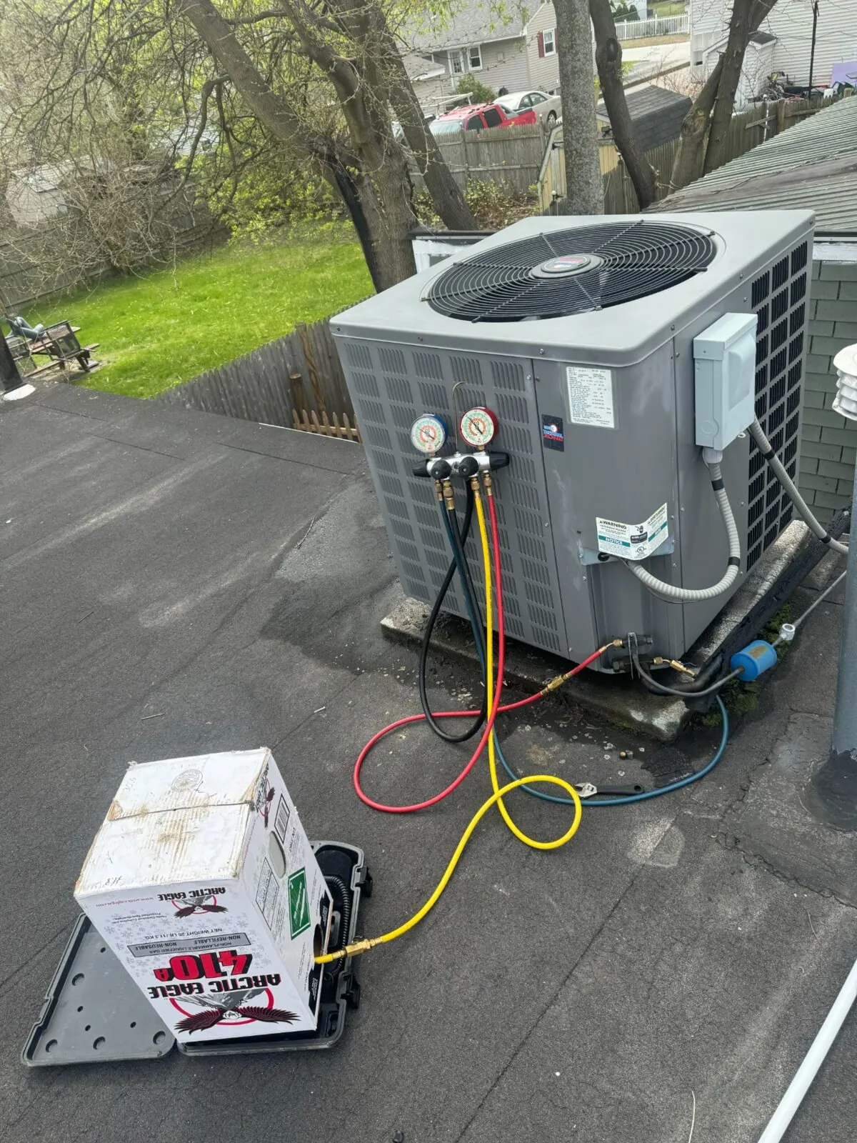 Air-conditioning condenser connected to service gauges