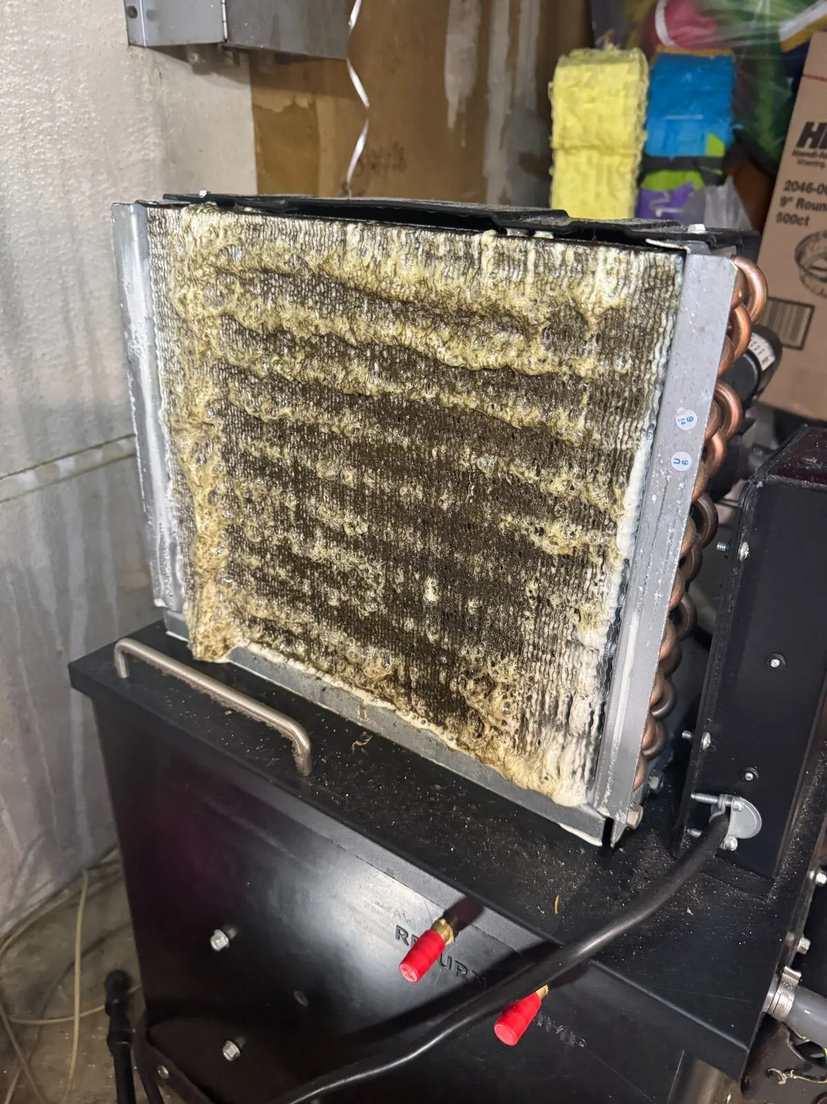Coil before cleaning, with heavy visible buildup