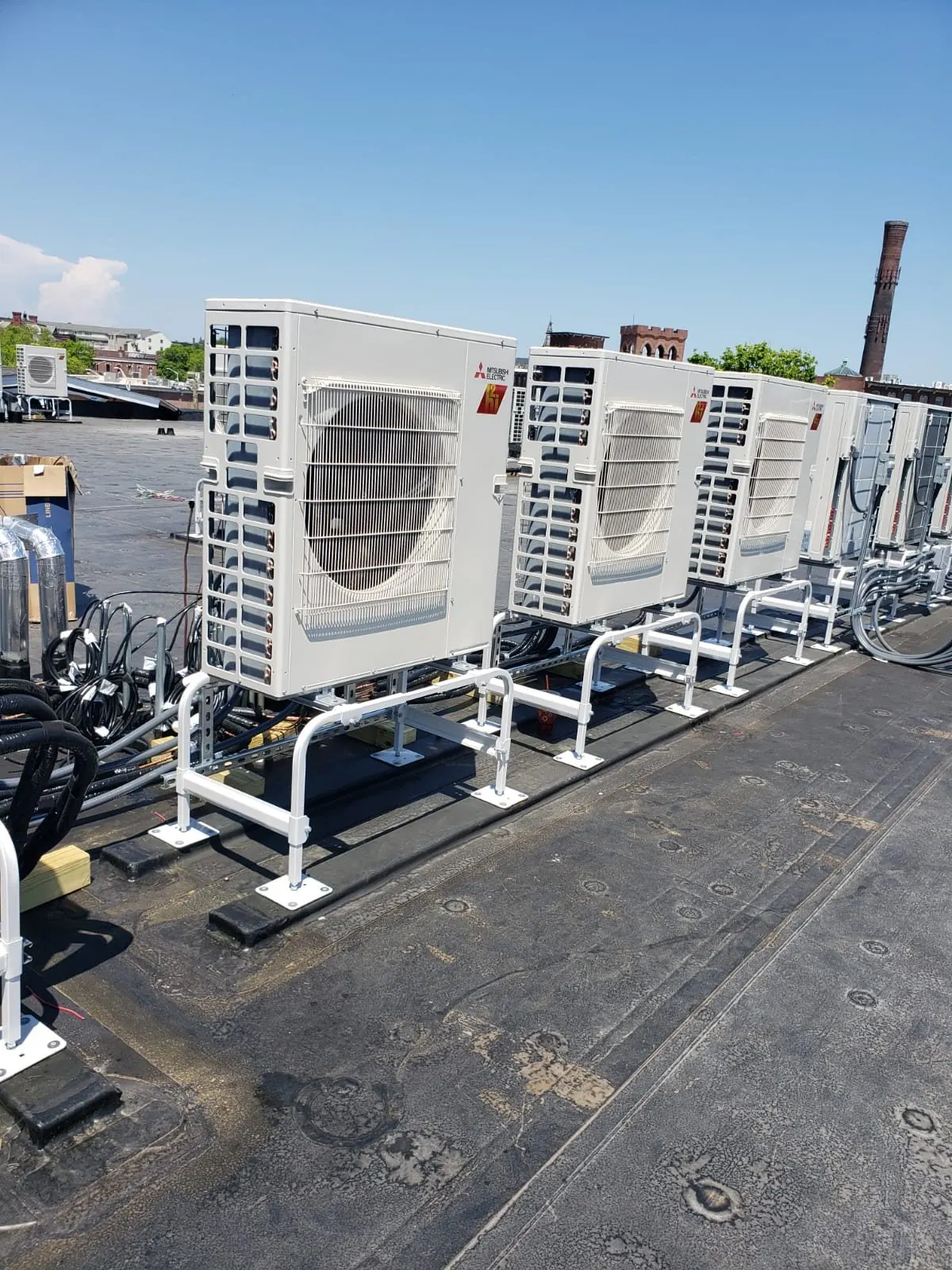 Mitsubishi outdoor units installed on a rooftop