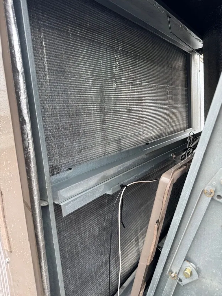 Clean coil inside a commercial rooftop unit after cleaning