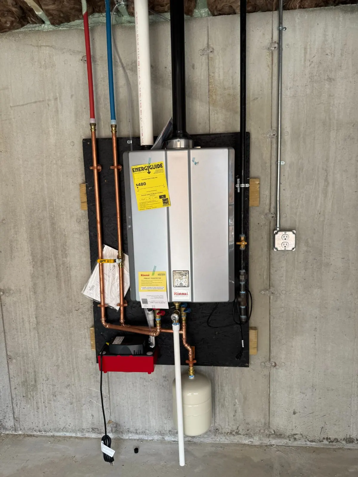 Wall-mounted Rinnai tankless water heater installation